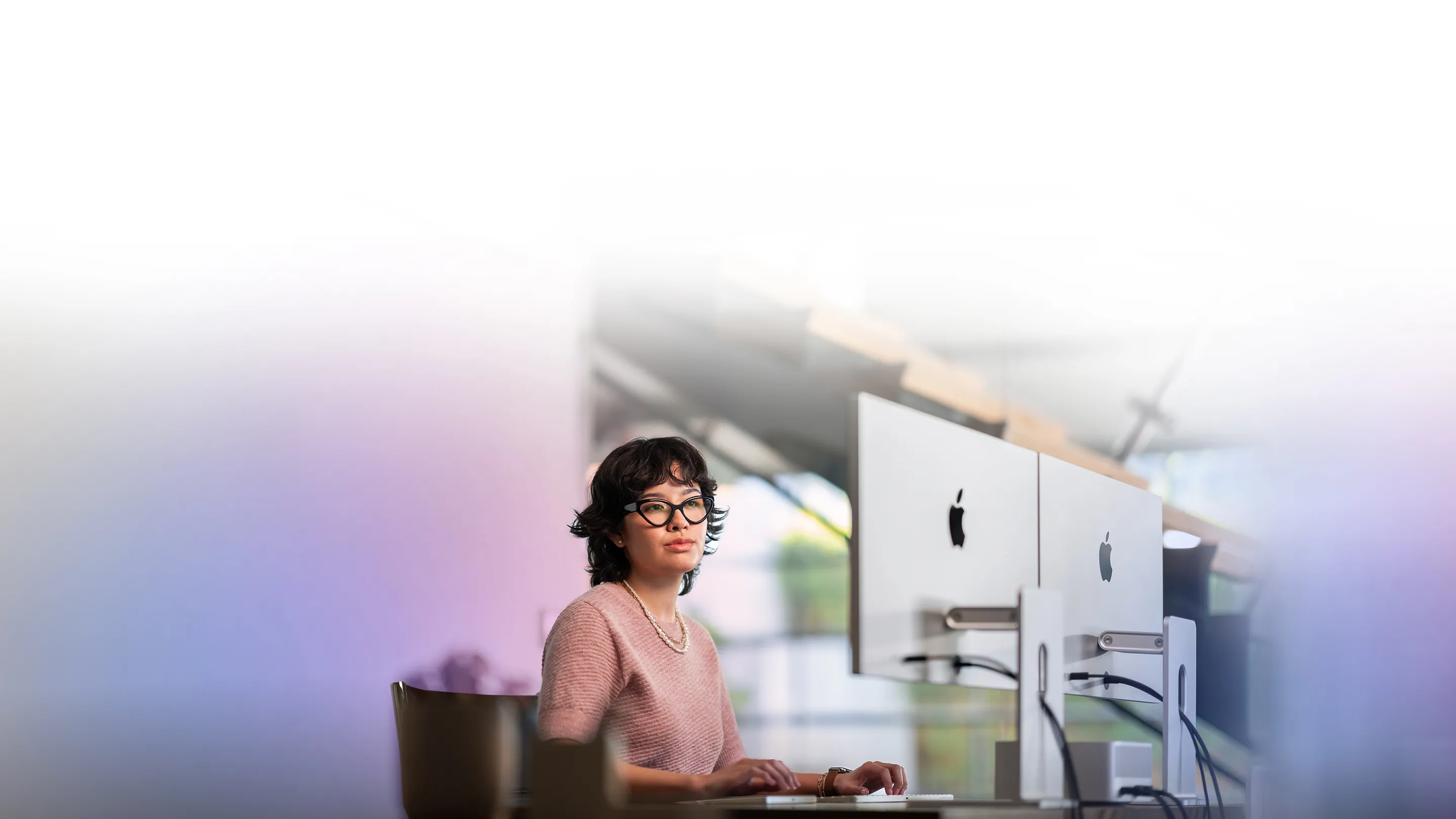 A FileMaker developer working at their desk.