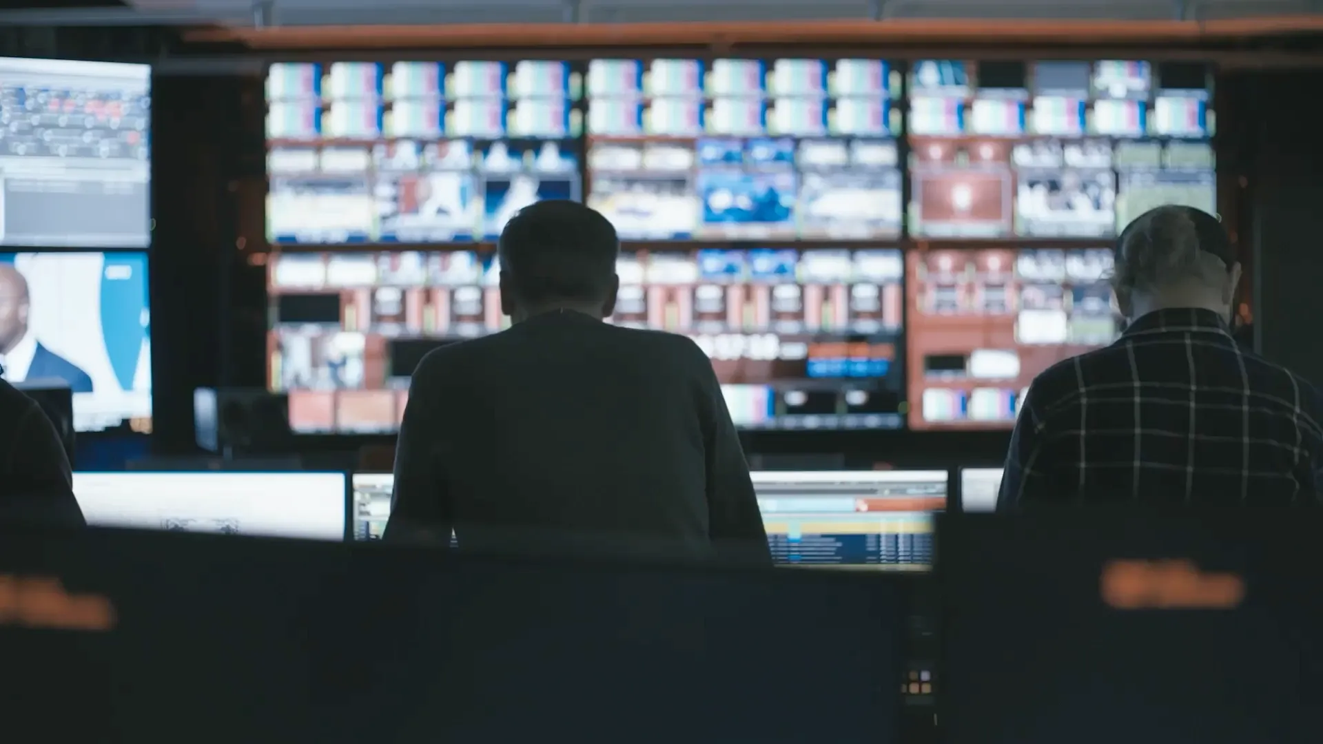 ESPN Netherlands broadcast control room with technicians monitoring video screens on the Claris homepage.